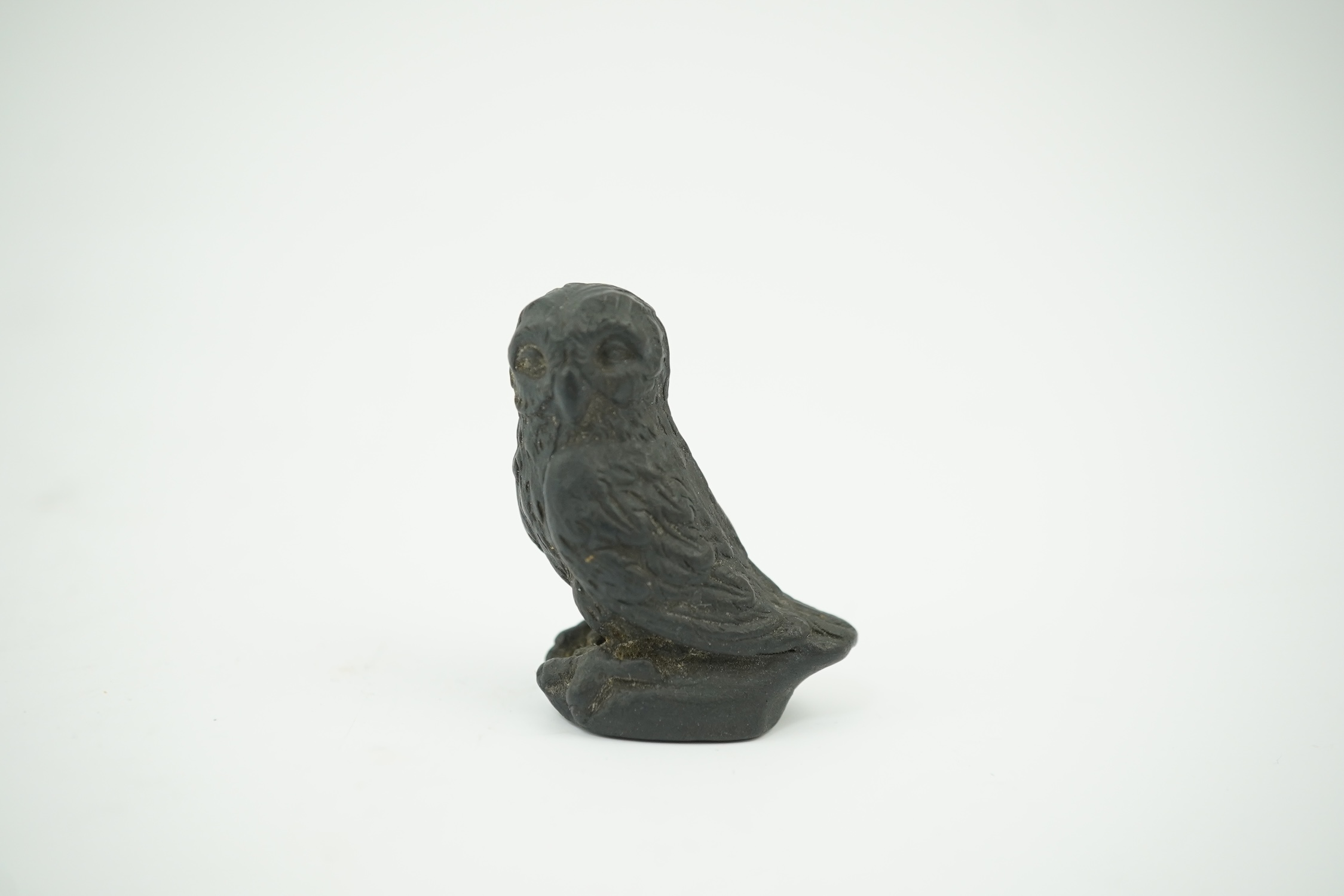 Attributed to Wedgwood, a black basalt intaglio fob seal, c.1809, modelled as an owl, inscribed ‘For further Particulars Enquire Within, 3.5cm high. Condition - good